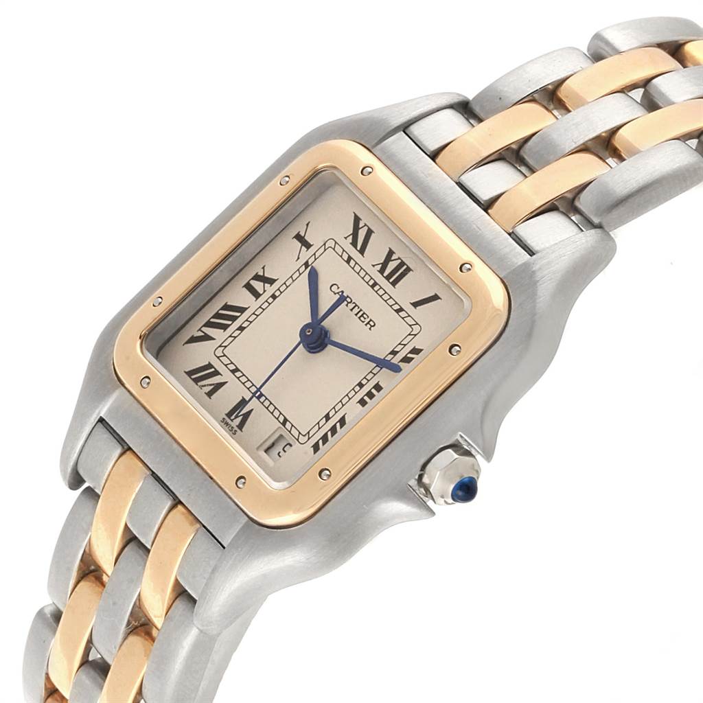 This image shows a Cartier Panthere W25028B8 Steel and Gold (two tone) Silver Dial W25028B8 Steel and Gold (two tone) Silver Dial watch at an angle that highlights the face, bezel, bracelet, and crown with a blue gemstone.