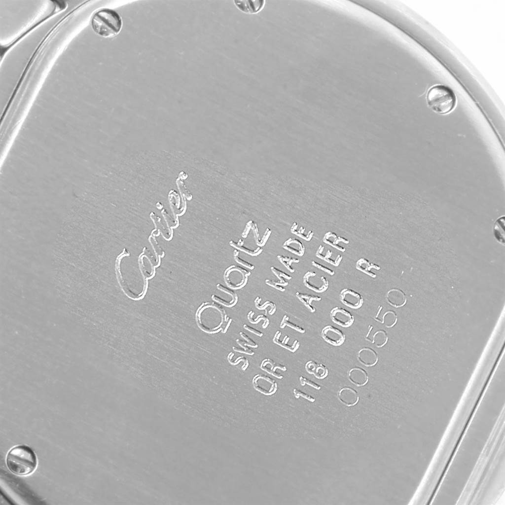 The image shows the back case of a Cartier Panthère watch at a slight angle, highlighting the engraved details and screws.