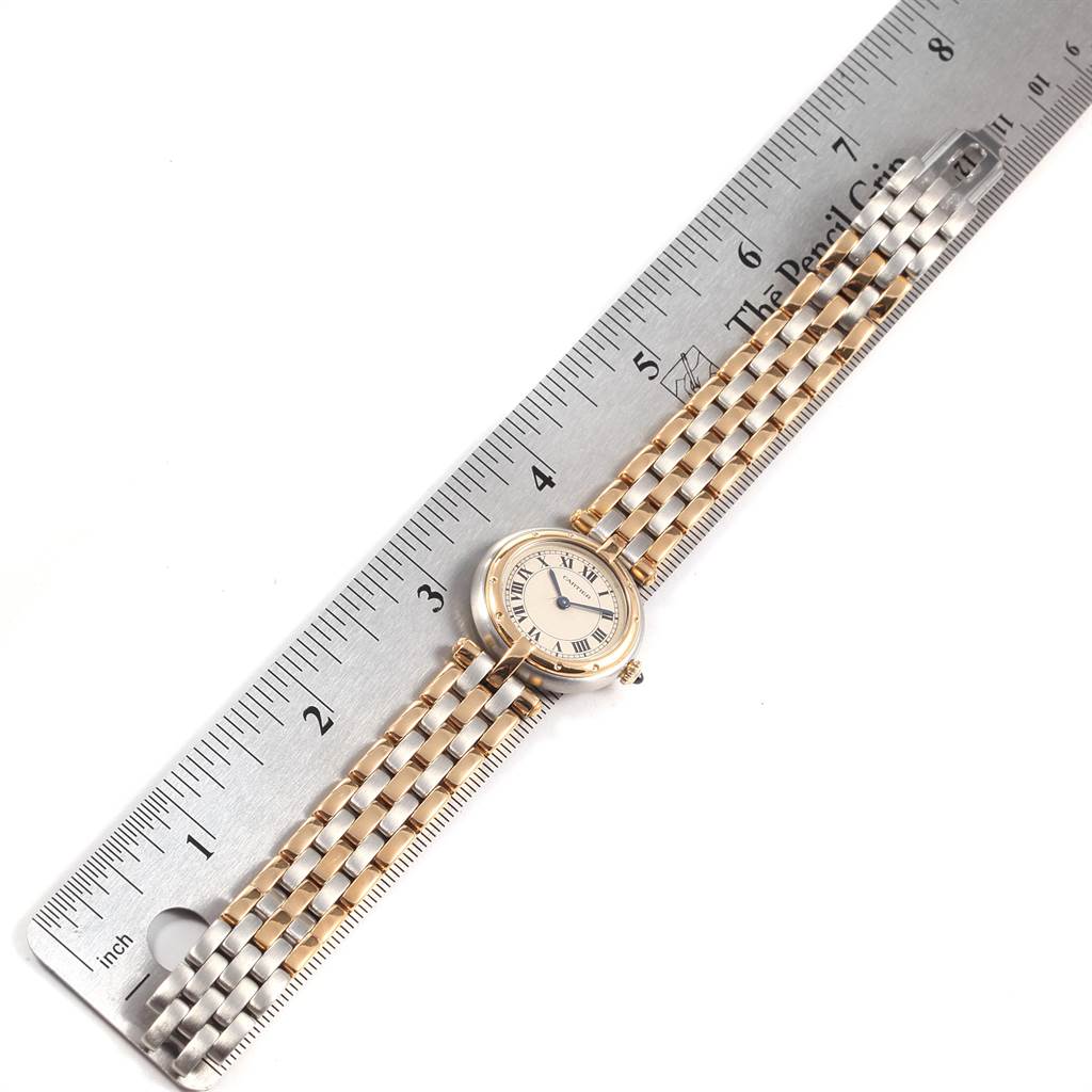 The image shows a top-down view of a Cartier Panthere 166920 Women's Steel and Gold (two tone) Silver Dial 166920 Women's Steel and Gold (two tone) Silver Dial watch, with the watch laying on top of a metal ruler.