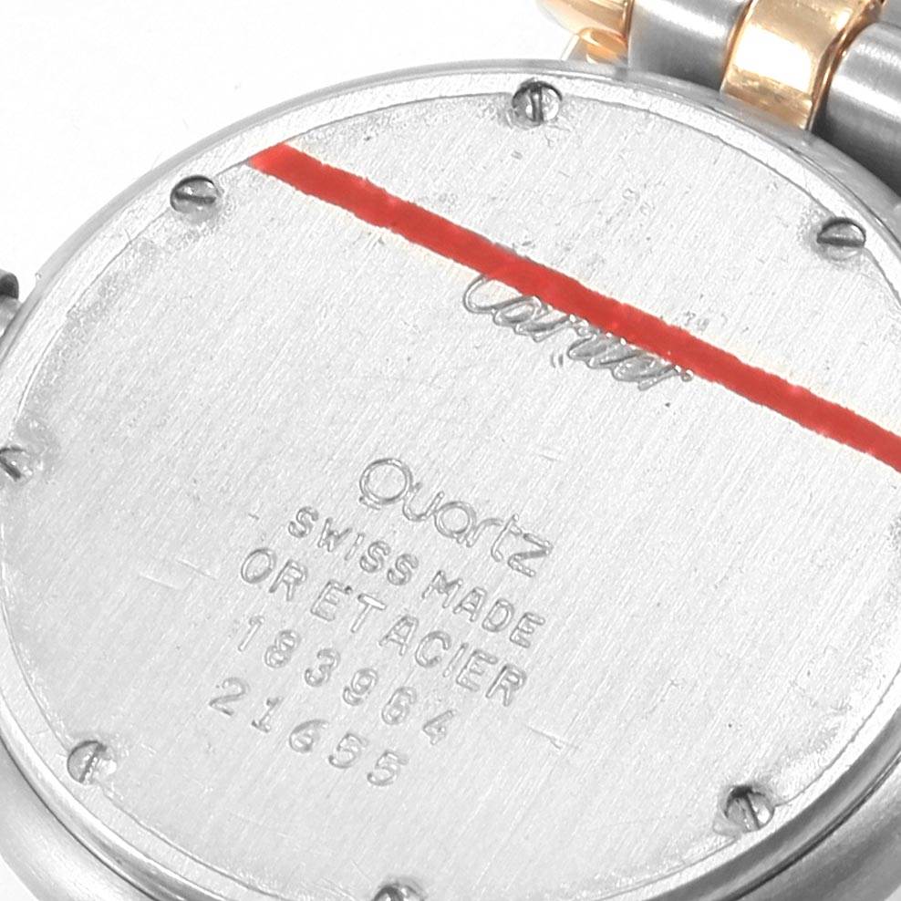 The image shows the back case of the Cartier Vendome 183964 Women's Steel and Gold (two tone) Silver Dial 183964 Women's Steel and Gold (two tone) Silver Dial watch, highlighting inscriptions and screws.