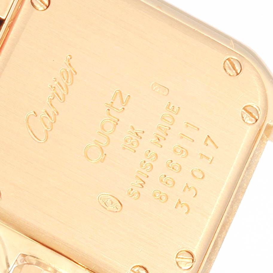 This is a close-up of the back of a Cartier Panthere W25022B9 Women's Yellow Gold Silver Dial W25022B9 Women's Yellow Gold Silver Dial watch, showing the engraving and screws.