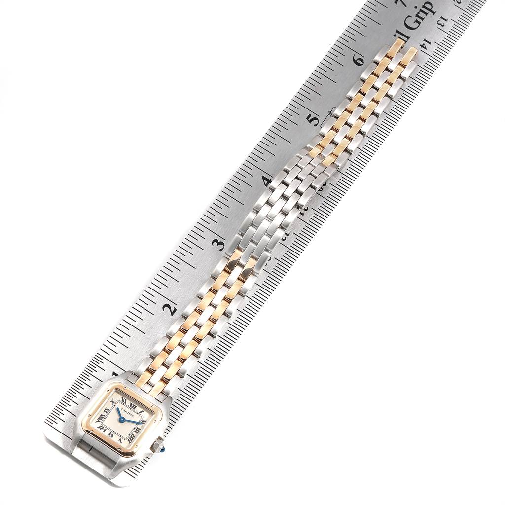 The image shows a Cartier Panthere W25029B6 Women
s Stainless Steel Silver Dial W25029B6 Women
s Stainless Steel Silver Dial model watch laid flat alongside a ruler measuring the length of its two-tone bracelet.