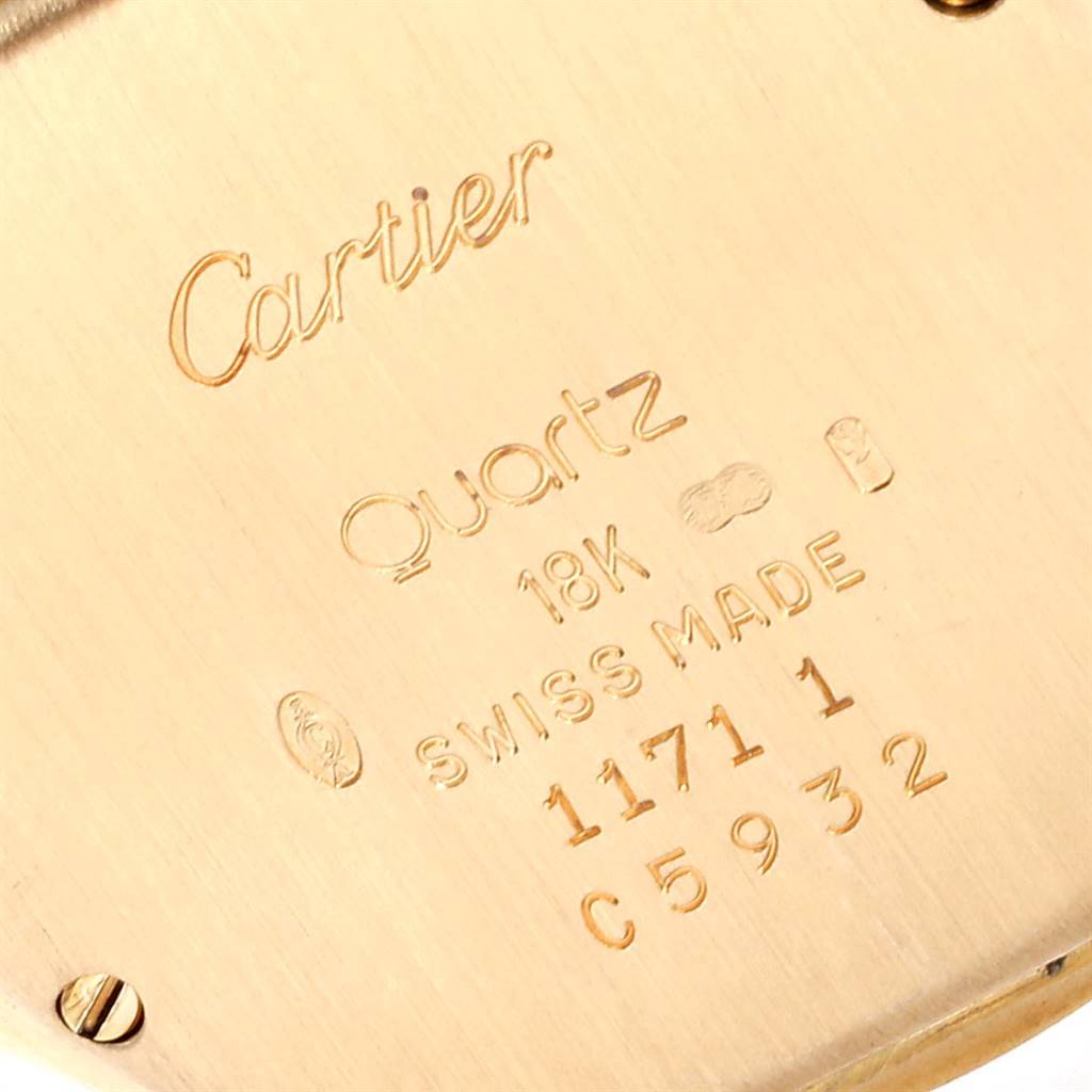 This is a close-up of the back case of a Cartier Panthere 1171 Women's Yellow Gold Silver Dial 1171 Women's Yellow Gold Silver Dial watch, showing the brand, model, material, and serial number inscriptions.