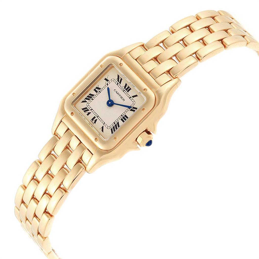 The image shows a Cartier Panthere W25022B9 Women's Yellow Gold Silver Dial W25022B9 Women's Yellow Gold Silver Dial watch at an angle showcasing its face, crown, and gold bracelet.