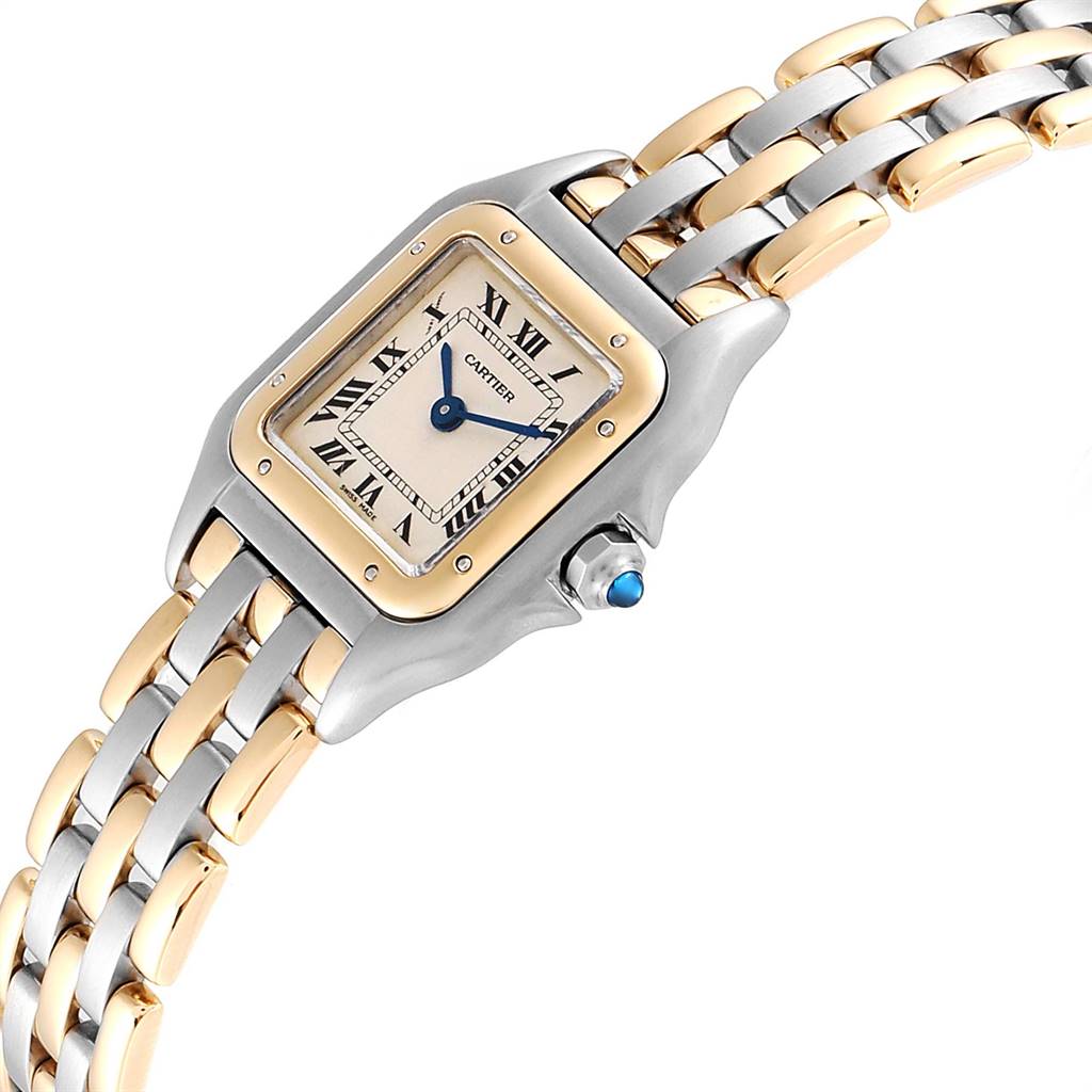 This image shows a Cartier Panthère model watch, highlighting its face, Roman numeral dial, dual-tone bracelet, and crown with a blue cabochon.