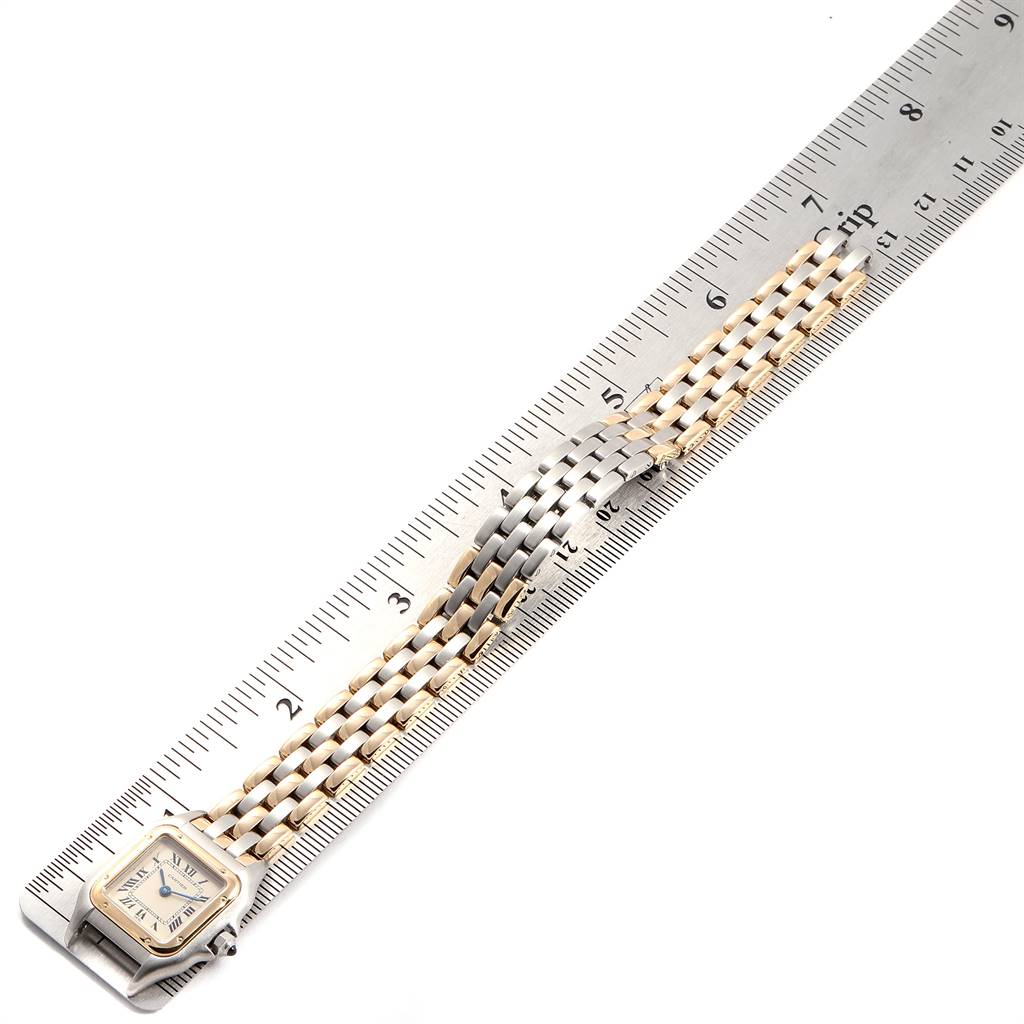 The image shows a Cartier Panthere W25029B6 Women's Stainless Steel Beige Dial W25029B6 Women's Stainless Steel Beige Dial model watch from an angled top-down view, displaying both the face and the bracelet beside a ruler.