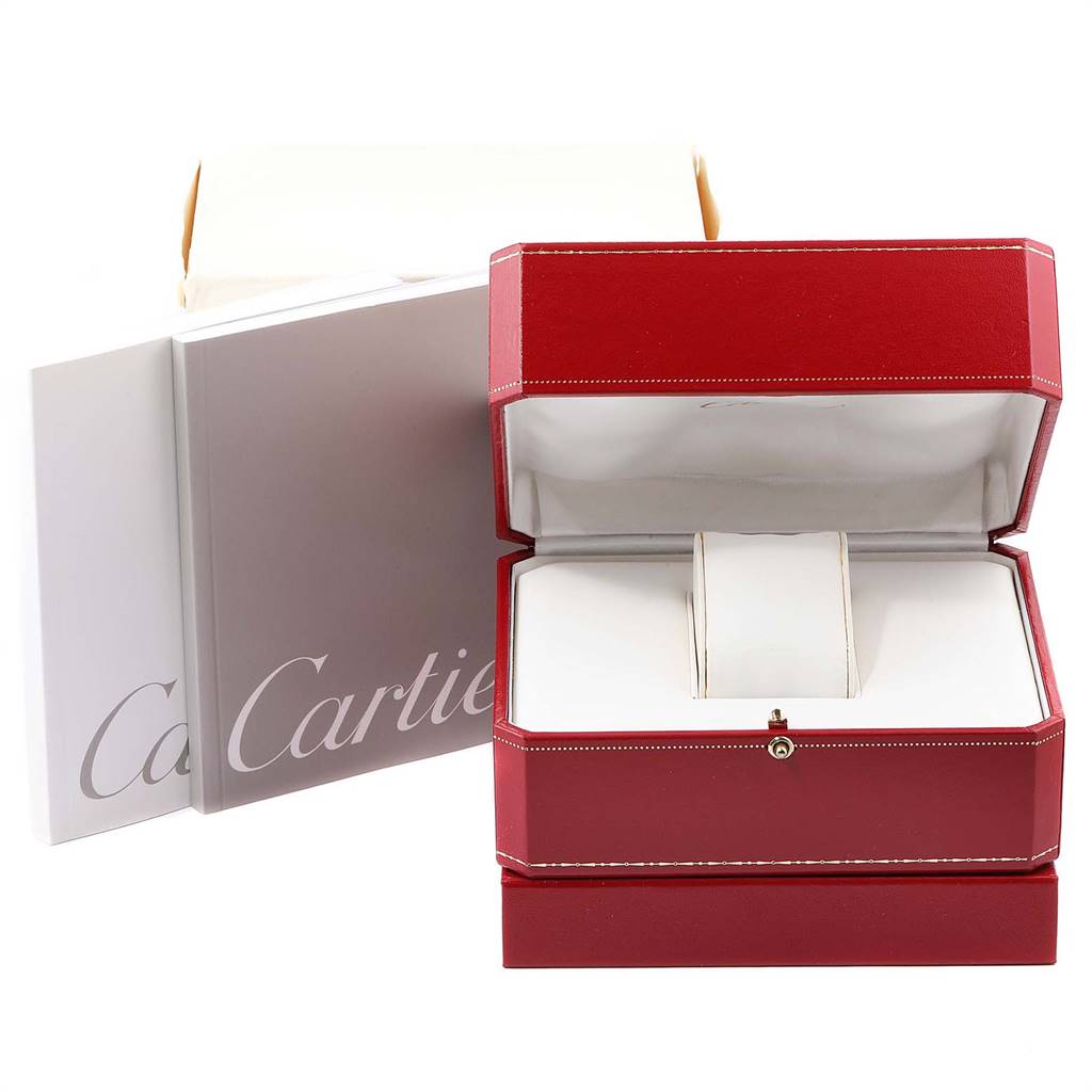 This image shows an open red Cartier watch box and accompanying booklets for the Panthere model.