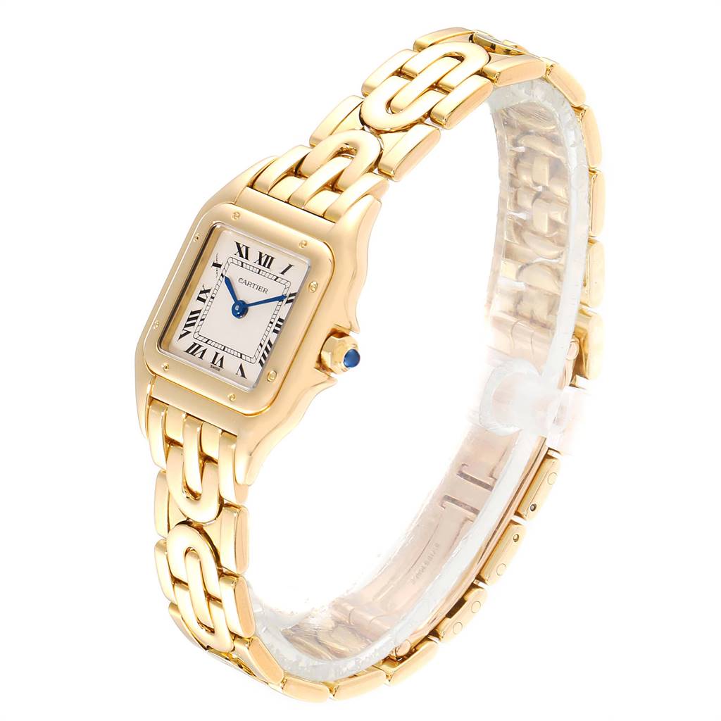 The image shows a Cartier Panthère watch from a side angle, displaying its gold bracelet and square face with blue hands.