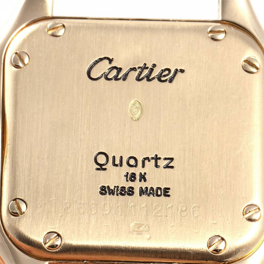The image shows the back case of a Cartier Panthere W25022B9 Women's Yellow Gold Silver Dial W25022B9 Women's Yellow Gold Silver Dial model watch, highlighting the brand, movement type, material, and country of origin.