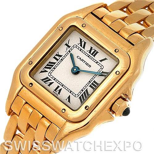 This image shows a Panthere de Cartier watch viewed from an overhead angle, highlighting its gold square face, Roman numerals, and metal bracelet.