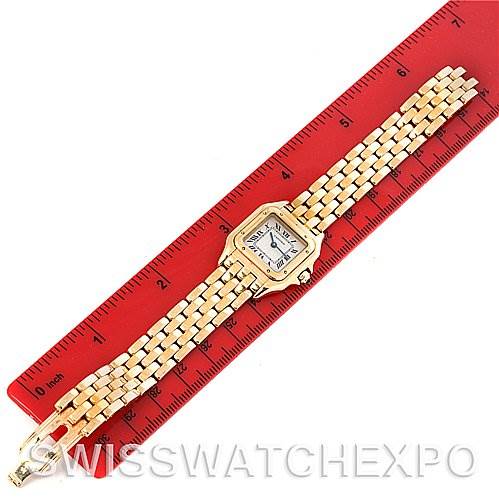 The image shows a top-down view of a Cartier Panthere W25022B9 Women's Yellow Gold Silver Dial W25022B9 Women's Yellow Gold Silver Dial watch, positioned beside a red ruler for scale.