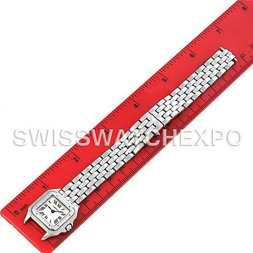 The Cartier Panthere W25033P5 Women
s Stainless Steel Silver Dial W25033P5 Women
s Stainless Steel Silver Dial watch is positioned flat next to a red ruler, showcasing its front face and metal bracelet.