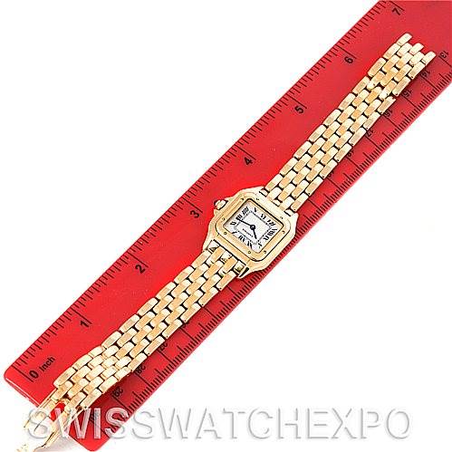 The image shows a Cartier Panthere W25022B9 Women's Yellow Gold Silver Dial W25022B9 Women's Yellow Gold Silver Dial model watch laid flat for measurement against a red ruler.