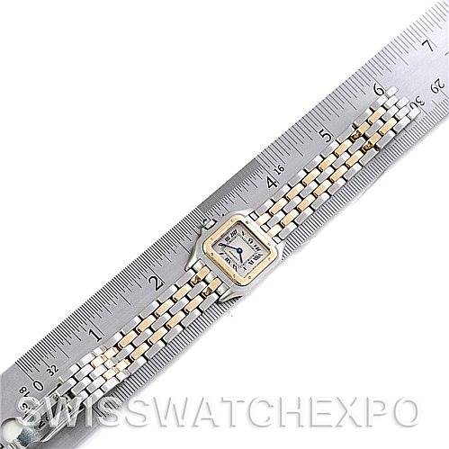 The image shows a Panthere model by Cartier, including its face and two-tone bracelet, placed next to a measuring ruler.