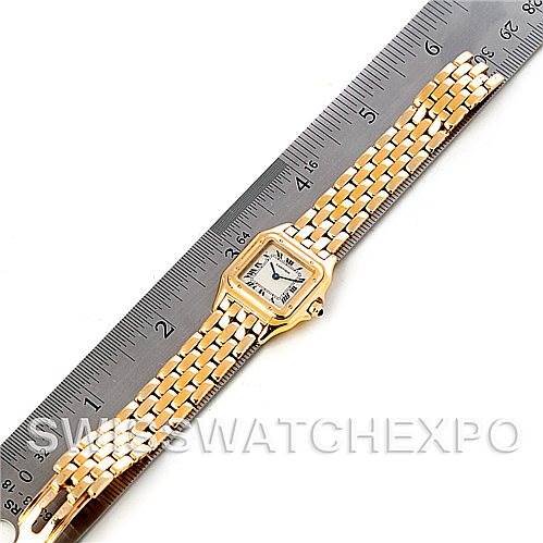 The image shows a Cartier Panthere W25022B9 Women's Yellow Gold Silver Dial W25022B9 Women's Yellow Gold Silver Dial watch laid flat alongside a ruler, displaying both the dial and the bracelet.