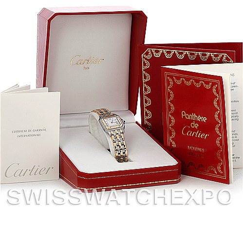 The Panthere de Cartier watch is shown in its open box along with the guarantee certificate and instruction booklet.