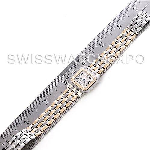 The image shows a top view of a Cartier Panthere W25029B6 Women
s Stainless Steel Silver Dial W25029B6 Women
s Stainless Steel Silver Dial model watch with a two-tone bracelet placed alongside a ruler for scale.