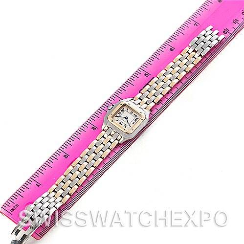 The image shows an overhead view of a Cartier Panthere W25029B6 Women
s Stainless Steel Silver Dial W25029B6 Women
s Stainless Steel Silver Dial watch next to a pink ruler, displaying the face and entire band.