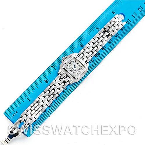 The image shows a top-down view of a Cartier Panthere W25033P5 Women
s Stainless Steel Silver Dial W25033P5 Women
s Stainless Steel Silver Dial watch placed on a blue ruler.