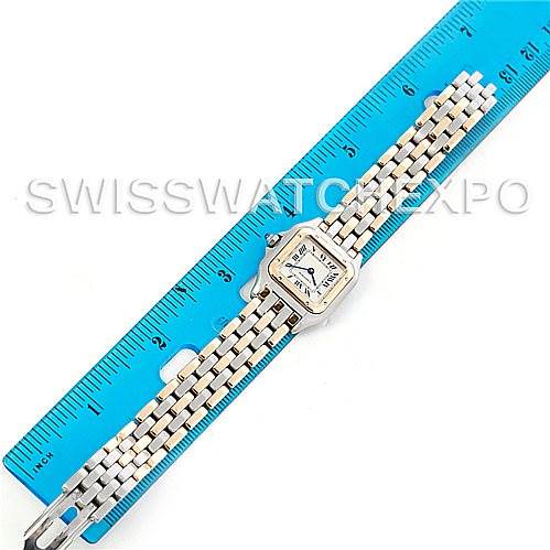 The image shows an overhead view of a Cartier Panthere W25029B6 Women
s Stainless Steel Silver Dial W25029B6 Women
s Stainless Steel Silver Dial watch fully extended next to a blue ruler.