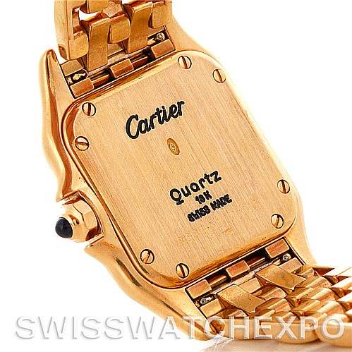 The image shows the back case and bracelet of a Cartier Panthere W25022B9 Women
s Yellow Gold Silver Dial W25022B9 Women
s Yellow Gold Silver Dial model watch, focusing on the quartz movement and Swiss made inscription.