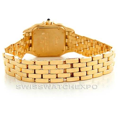 The image shows the back view of a gold Panthere model watch by Cartier, focusing on the case back and bracelet.