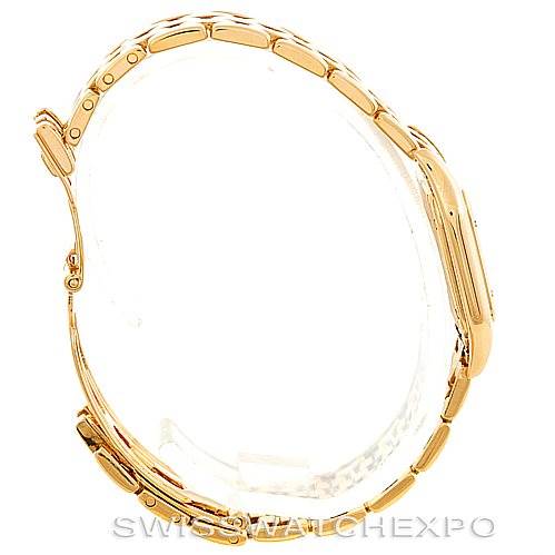 This image shows a side view of the Cartier Panthere W25022B9 Women's Yellow Gold Silver Dial W25022B9 Women's Yellow Gold Silver Dial watch, highlighting its gold bracelet and case.