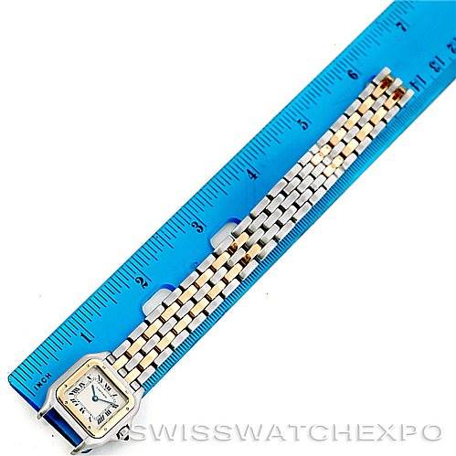 The image shows a top-down view of the Cartier Panthere W25029B6 Women
s Stainless Steel Silver Dial W25029B6 Women
s Stainless Steel Silver Dial watch with its length measured against a blue ruler.