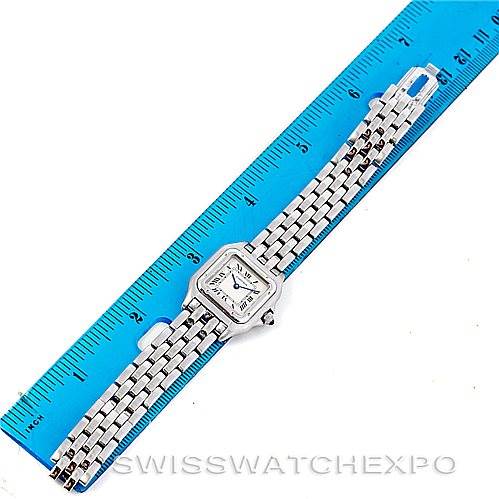 This image shows a full view of a Cartier Panthère model watch laid next to a ruler for measurement.