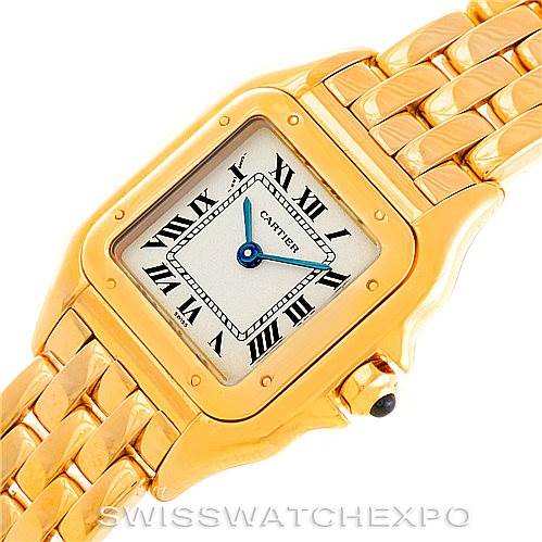 This image shows the face and part of the bracelet of a Cartier Panthere W25022B9 Women's Yellow Gold Silver Dial W25022B9 Women's Yellow Gold Silver Dial watch, with a gold case and Roman numeral markers.