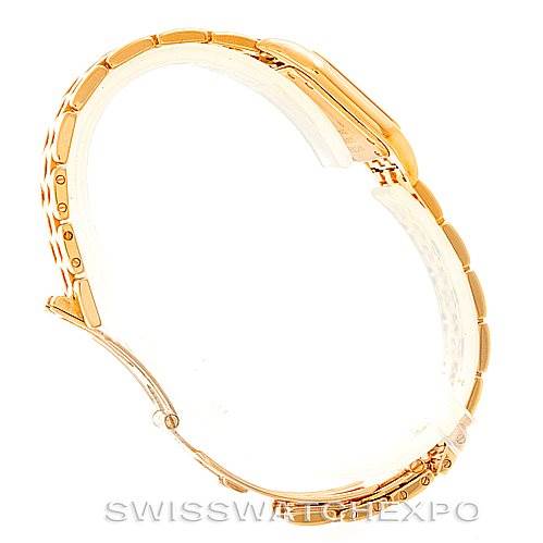 This image shows a side view of the Panthere model watch by Cartier, highlighting its gold bracelet and case.