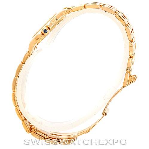 This image shows the side view of a Panthere model by Cartier, highlighting the gold bracelet and the crown with a blue cabochon.
