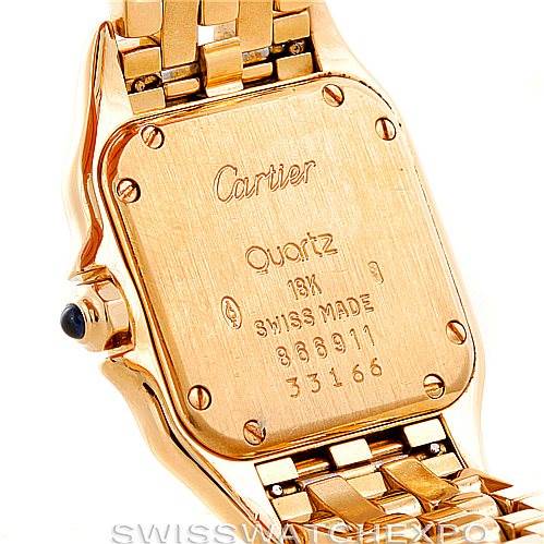 This image shows the back case and a portion of the bracelet of a Cartier Panthère watch, highlighting its engravings and gold finish.