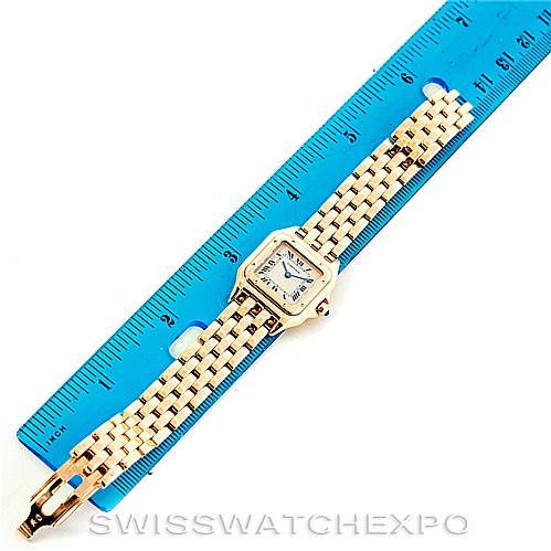 The image shows a Cartier Panthere W25022B9 Women's Yellow Gold Silver Dial W25022B9 Women's Yellow Gold Silver Dial watch laid flat next to a ruler, displaying its full length and bracelet.