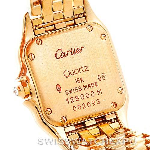 The image shows the back case of a Panthere model watch by Cartier, highlighting the screws, inscriptions, and part of the bracelet.