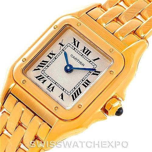 This image shows a close-up of the face and part of the bracelet of a Cartier Panthere W25022B9 Women's Yellow Gold Silver Dial W25022B9 Women's Yellow Gold Silver Dial watch, highlighting its gold-tone finish and Roman numerals.