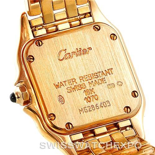 The image shows the back case and part of the bracelet of a Cartier Panthere W25022B9 Women's Yellow Gold Silver Dial W25022B9 Women's Yellow Gold Silver Dial watch, highlighting engravings and screw details.