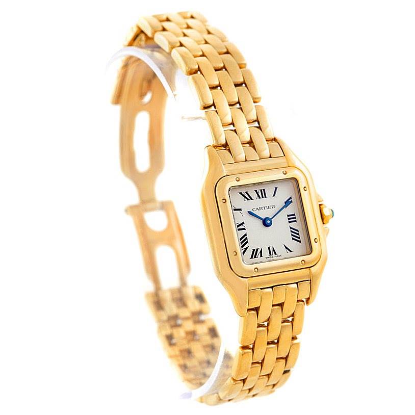 The image shows a Cartier Panthère watch in gold, displaying the face, bezel, crown, and bracelet from a front-side angle.