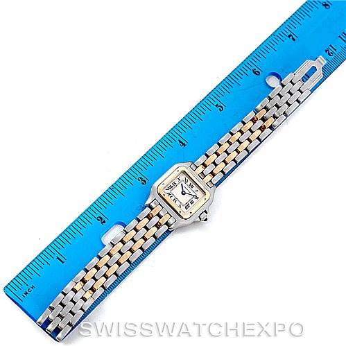 The image shows a Panthere model by Cartier watch laid flat, next to a blue ruler measuring its length.
