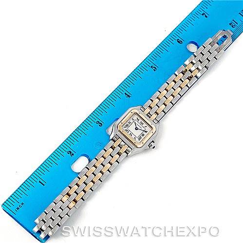 This image shows a top view of the Cartier Panthere W25029B6 Women
s Stainless Steel Silver Dial W25029B6 Women
s Stainless Steel Silver Dial watch placed above a blue ruler.