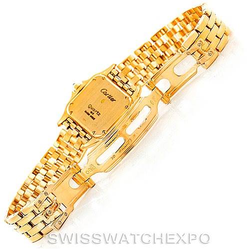 The image shows the back case and open clasp of a gold Panthere model watch by Cartier.