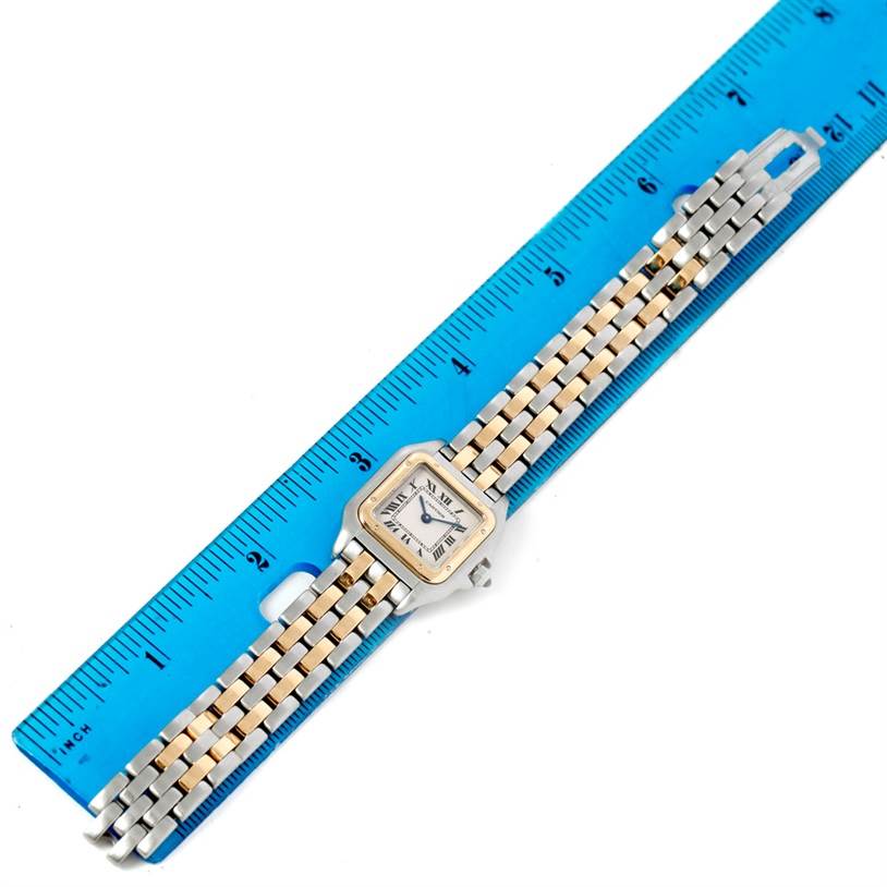 The Cartier Panthere W25029B6 Women
s Stainless Steel Silver Dial W25029B6 Women
s Stainless Steel Silver Dial watch is shown flat, face up, next to a blue ruler for measurement.