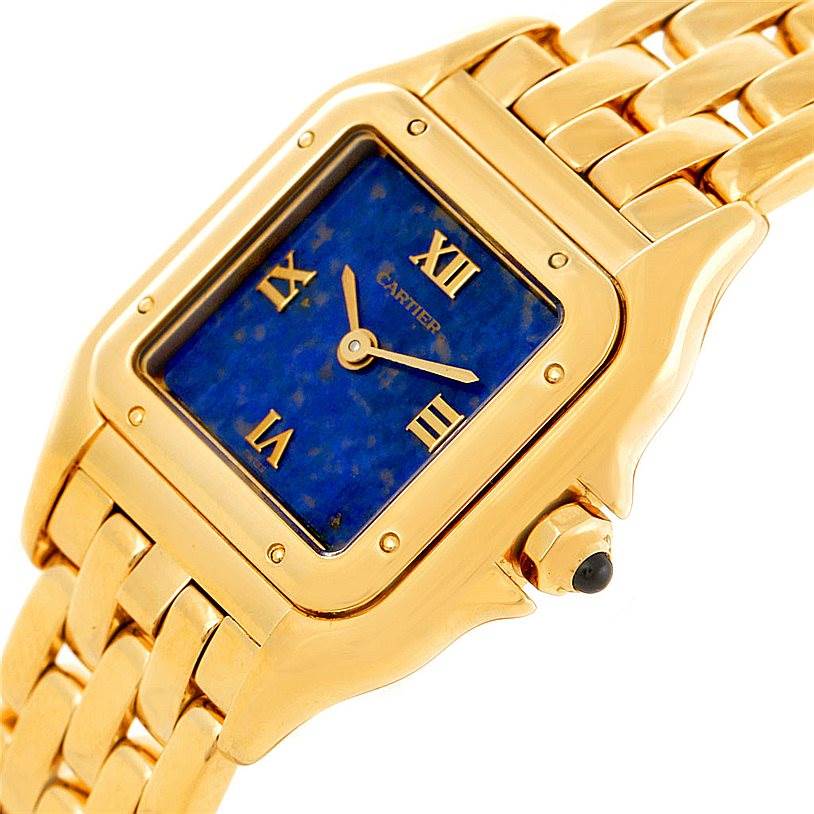 The image shows a close-up of the Cartier Panthere W25022B9 Women's Yellow Gold Blue Dial W25022B9 Women's Yellow Gold Blue Dial watch from an angled view, displaying the face, bezel, and part of the bracelet.