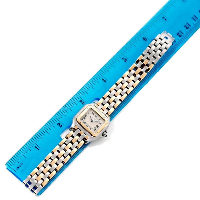 The image shows the full length of the Cartier Panthere W25029B6 Women
s Stainless Steel Silver Dial W25029B6 Women
s Stainless Steel Silver Dial watch laid flat next to a blue ruler for measurement.