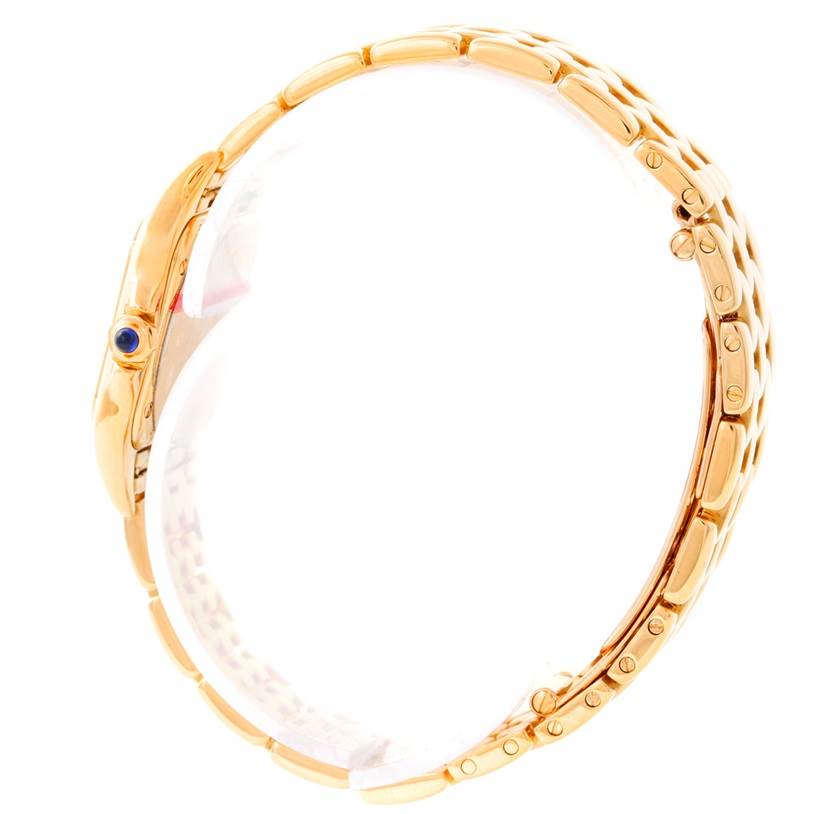 This Cartier Panthere W25022B9 Women
s Yellow Gold Silver Dial W25022B9 Women
s Yellow Gold Silver Dial model watch is shown from a side angle, highlighting the gold bracelet and blue cabochon crown.