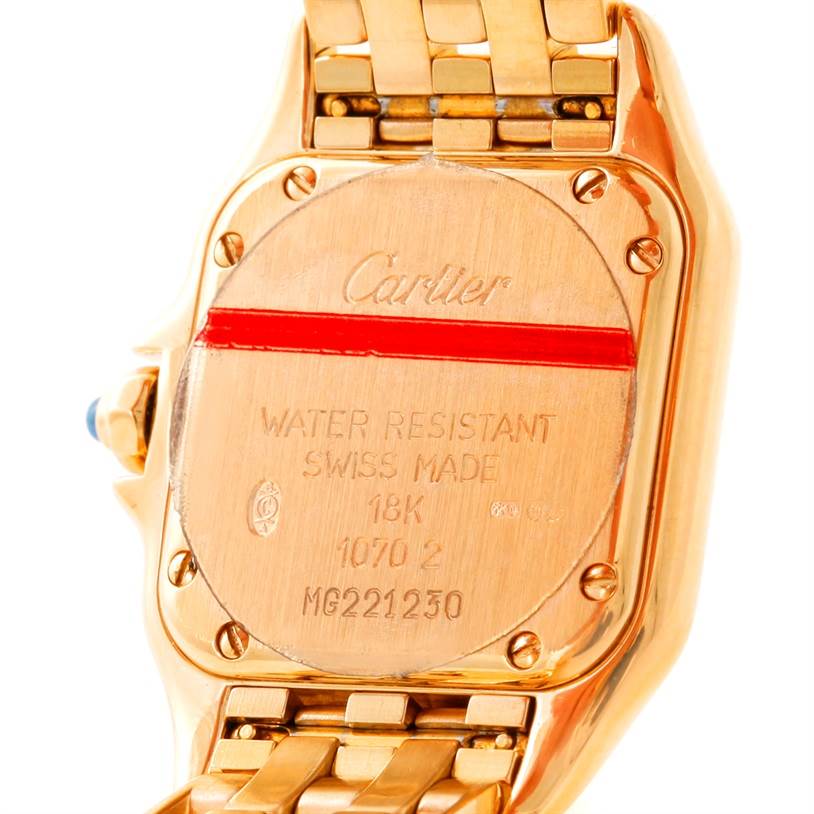 The image shows the back case and part of the bracelet of the Cartier Panthere W25022B9 Women
s Yellow Gold Silver Dial W25022B9 Women
s Yellow Gold Silver Dial watch.