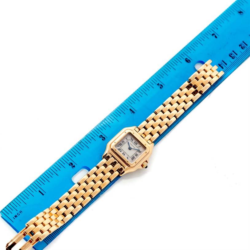 The image shows a top-down view of a Cartier Panthere W25022B9 Women's Yellow Gold Silver Dial W25022B9 Women's Yellow Gold Silver Dial watch next to a ruler for size reference.