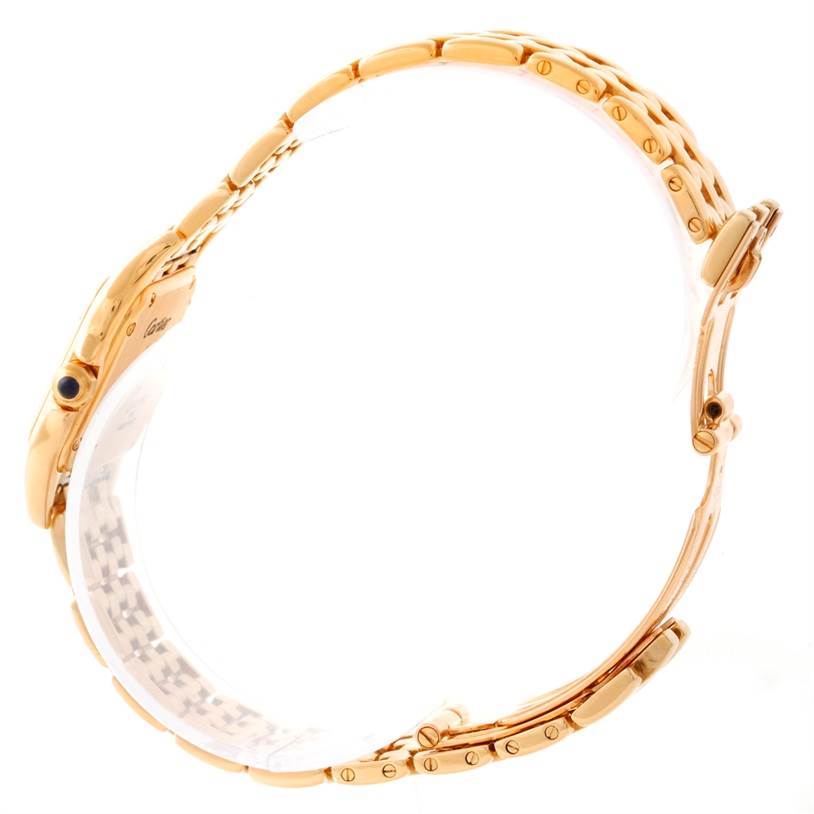 This image shows a side view of a Cartier Panthere W25022B9 Women's Yellow Gold Silver Dial W25022B9 Women's Yellow Gold Silver Dial watch, highlighting its gold bracelet and clasp.