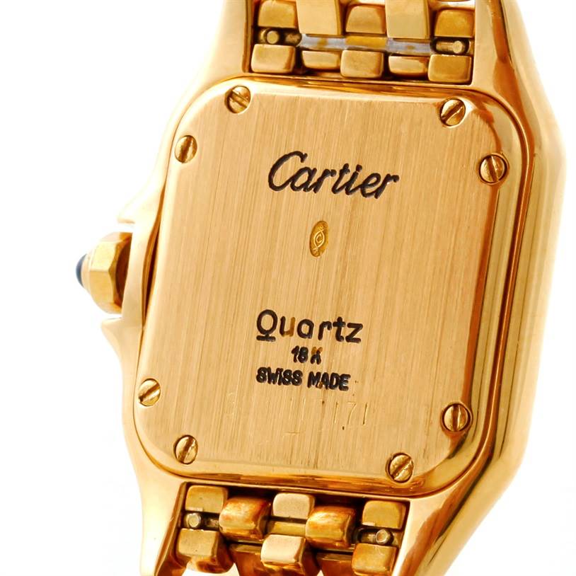 The image shows a close-up of the back case and part of the bracelet of a Cartier Panthere W25022B9 Women's Yellow Gold Silver Dial W25022B9 Women's Yellow Gold Silver Dial Quartz 18K watch.
