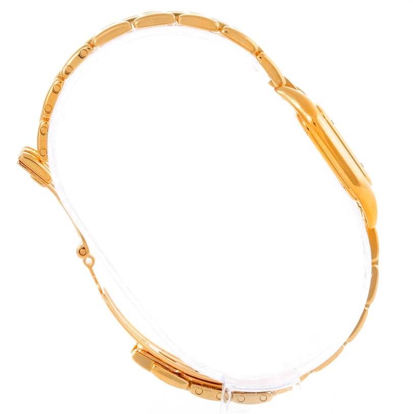 This image shows a side profile of the Cartier Panthere W25022B9 Women
s Yellow Gold Silver Dial W25022B9 Women
s Yellow Gold Silver Dial watch, highlighting its gold bracelet and case.